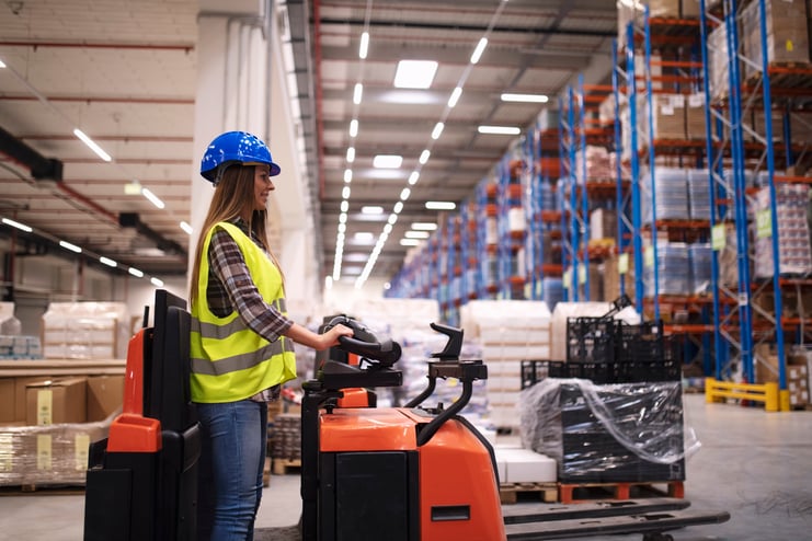 woman-warehouse-worker-operating-forklift-machine-large-distribution-warehouse-center